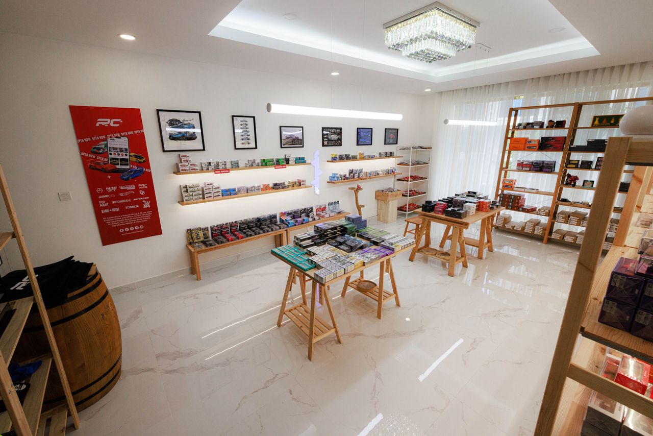 hero-img-02 Bright and modern RC model store interior featuring wood furniture and diecast models in Phnom Penh.